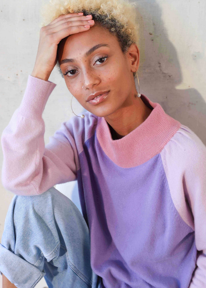 Model wearing purple sweater